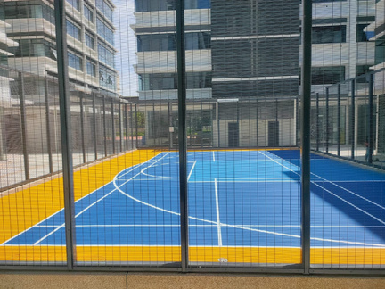Fenced sports court in a residential development